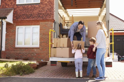 Furniture removals team handling sofa in Collierswood