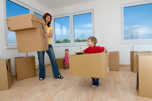 Packing boxes and furniture for a moving truck in Collierswood