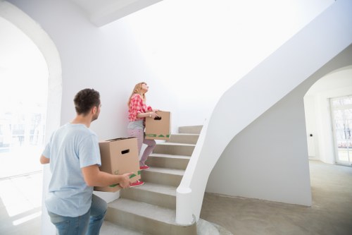 Experienced movers preparing furniture for transport in Collierswood