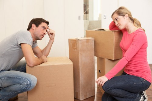 Removal team loading household items into a moving van