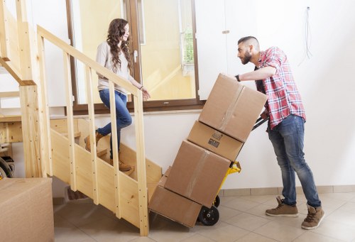 Moving crew completing a safe and organised unloading process