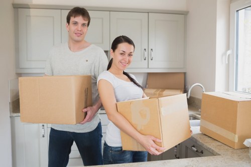 Professional movers organizing boxes and furniture for transport